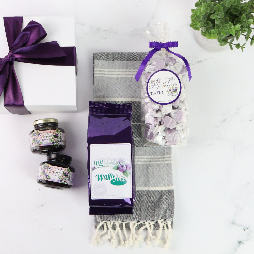 Gourmet wild huckleberry breakfast set featuring pancake mix, honey, jam, and taffy