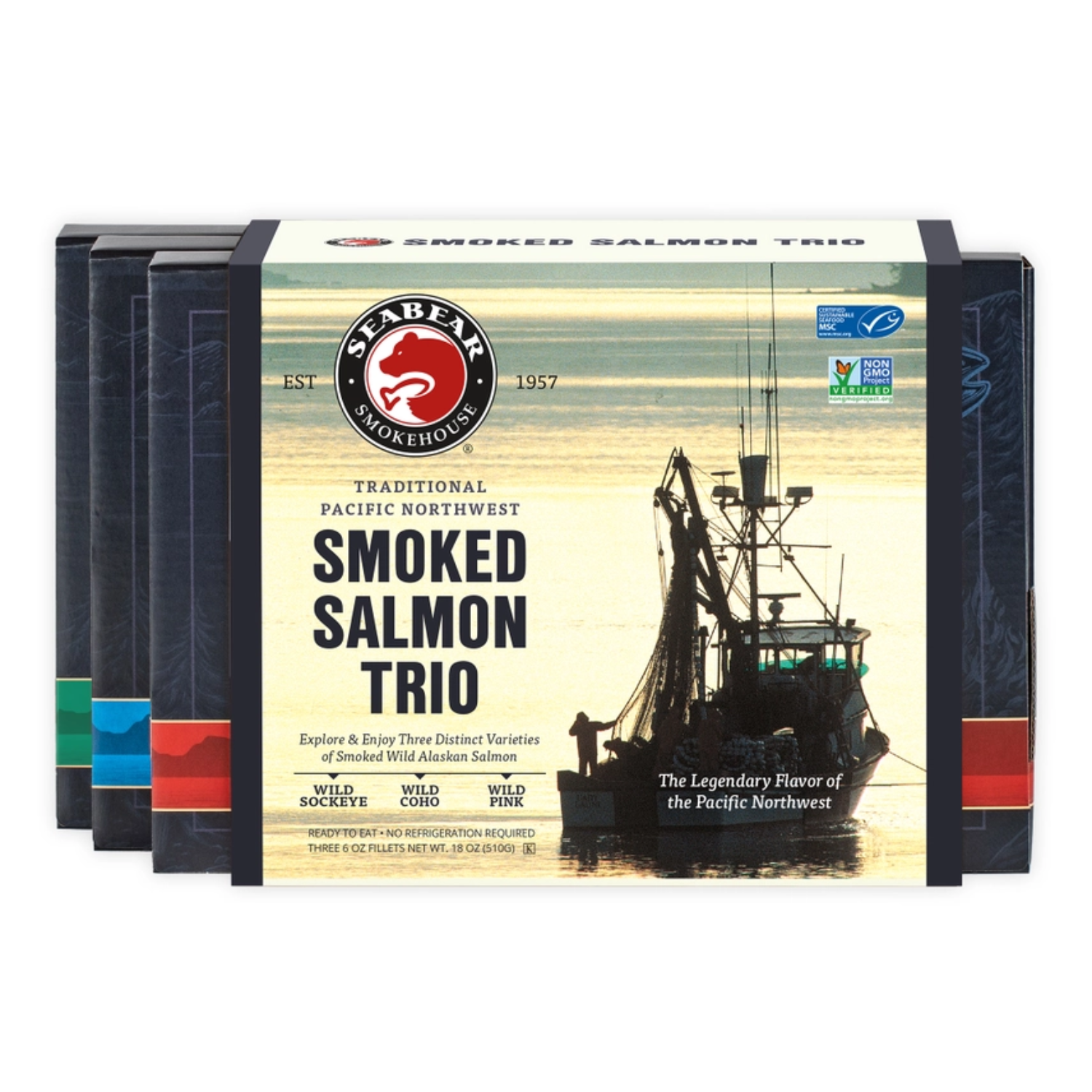 SeaBear Smoked Salmon Trio featuring Wild Sockeye, Wild Coho, and Wild Pink Salmon in a Pacific Northwest gift box with a fishing boat silhouette on the packaging.
